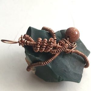 Wire wrapped green jasper with goldstone accent